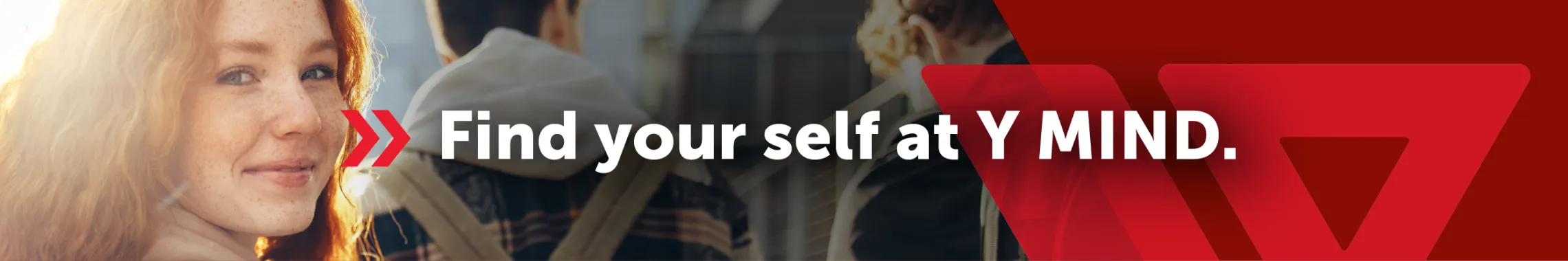 A young women is smiling at the camera. Text; Find your self at Y Mind.
