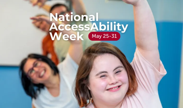 Text: National AccessAbility Week. May 25-31. Image: Three people smiling and raising their arms in a joyful pose during a group activity.