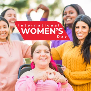 Text: International Women's Day. Image: 5 women making hearts with their hands. 